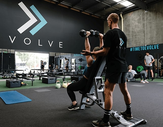 Woman and exercise trainer doing arm workout